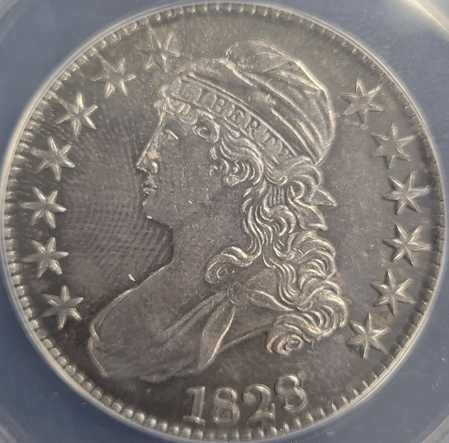 1828 Capped Lady Liberty 50c ANACS certified AU58