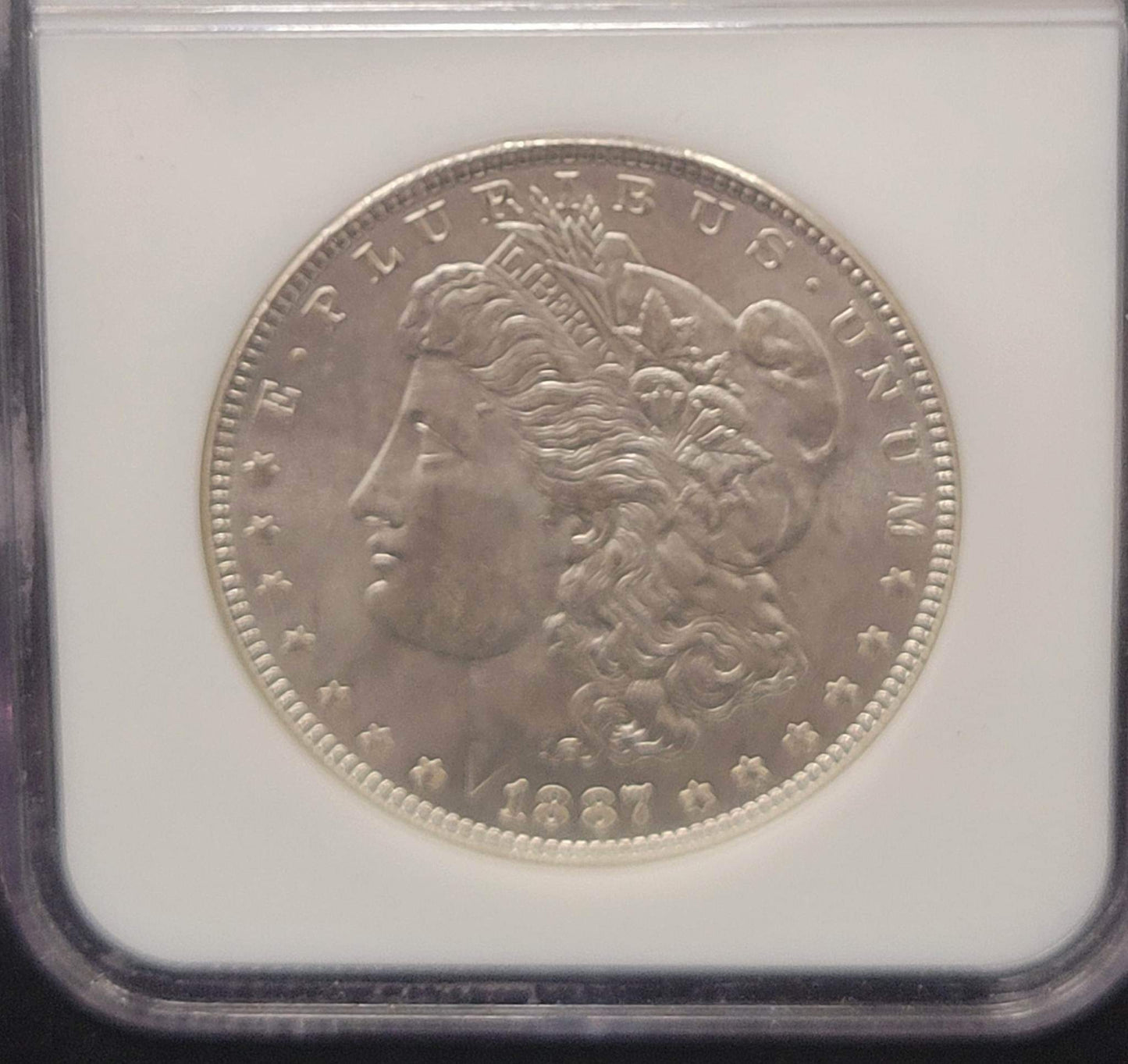 1887 Morgan Silver Dollar NGC MS64 certified $1